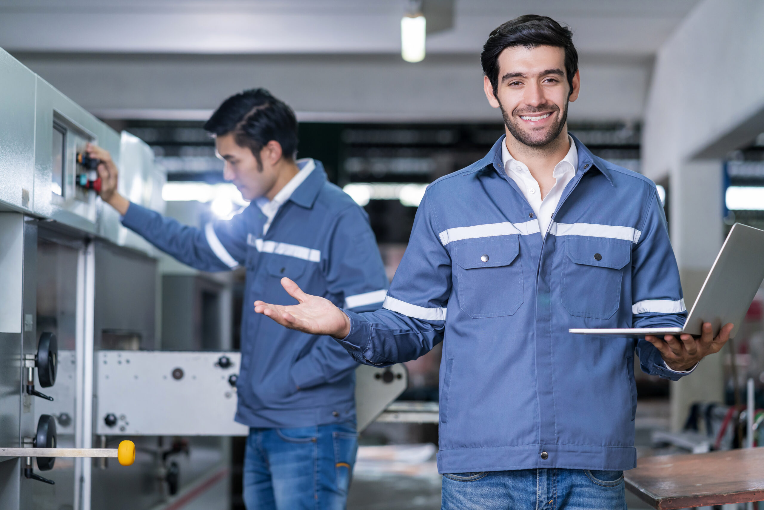 supervisor manager male engineer worker wears uniform working hand use laptop stock checking store warehouse shipping industrial team with safety uniform checking quantity product shelf